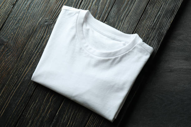 istock White sweatshirt on wooden background, space for text 1319921452