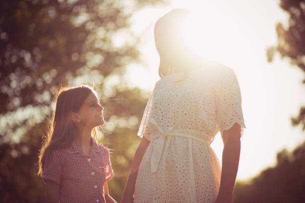 istock Mother and daughter playing together in nature. 1319922030