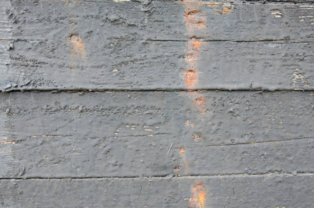 Wood texture in bitumen, background for creating marine-themed sites selective focus