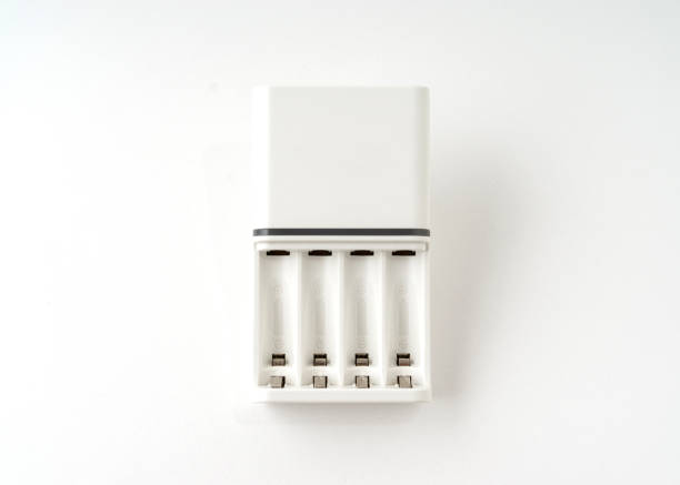 istock Dry cell battery charger isolated on white background. 1319924560
