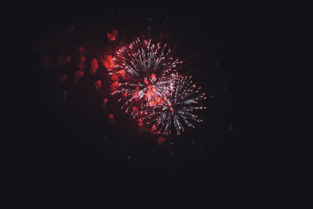 istock colorful fireworks on the night sky background. 1319924723