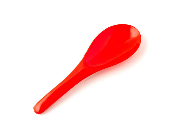 istock Red color of plastic spatula isolated on white background. 1319924833