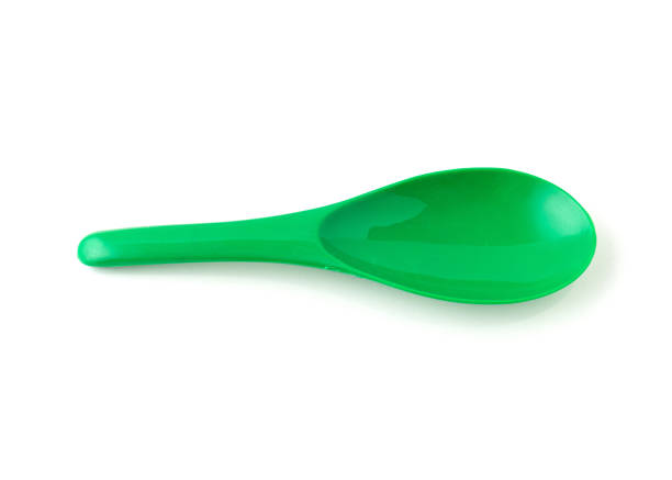 istock Green color of plastic spatula isolated on white background. 1319924879