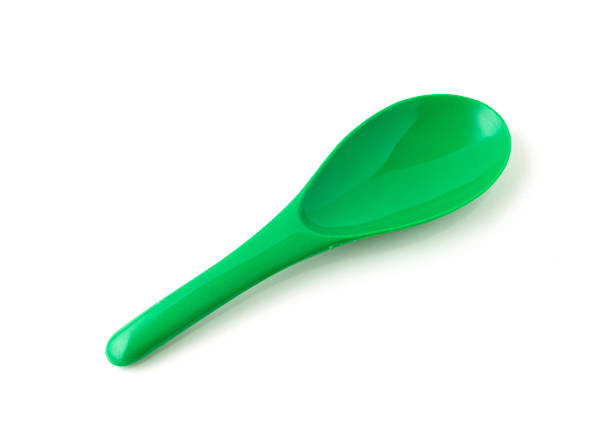 istock Green color of plastic spatula isolated on white background. 1319924884
