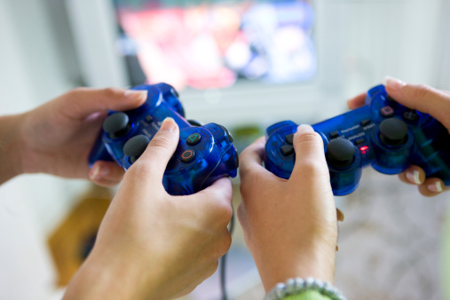 Two women  playing video game, selective focus, canon 1Ds mark III