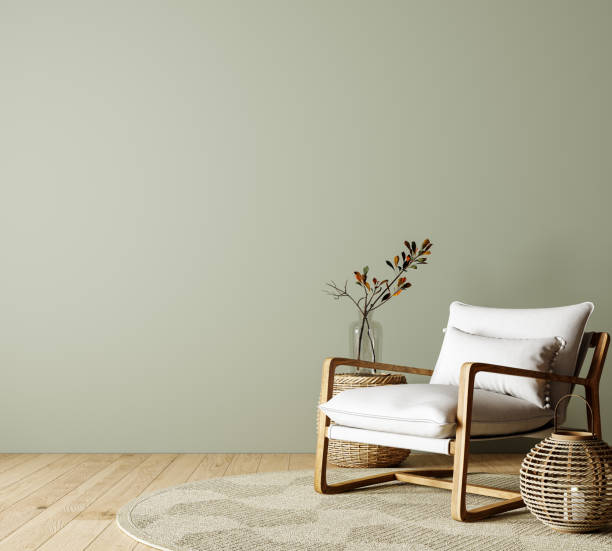 moderne inneneinrichtung des wohnzimmers mit sessel und leerem grünem mock-up-wandhintergrund - furniture design indoors armchair stock-fotos und bilder