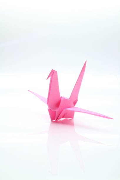 istock Beautiful paper cranes flapping their wings 1319929465