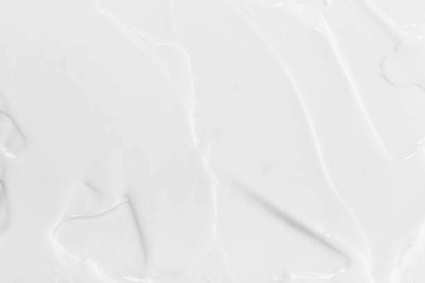 istock White Cosmetic Cream Isolated on White Background. Lipstick Smear. 1319929473