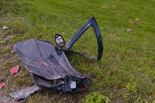 Remains of a car beside a mountain stream, which apparently fell from a dirt road up the mountain, in Unicoi County, Tennessee