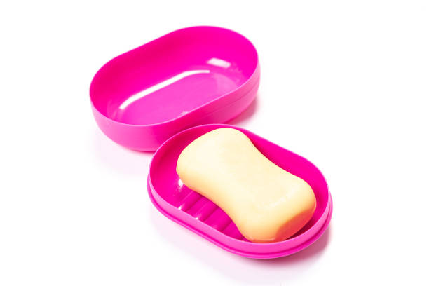 istock Soap in PLASTIC COLORED soap dish isolated on white background 1319929634