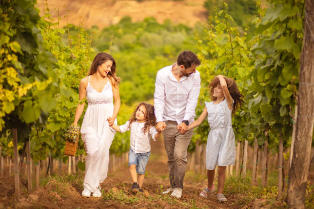 istock Family walking trough vineyard.  Time for walk. 1319929697