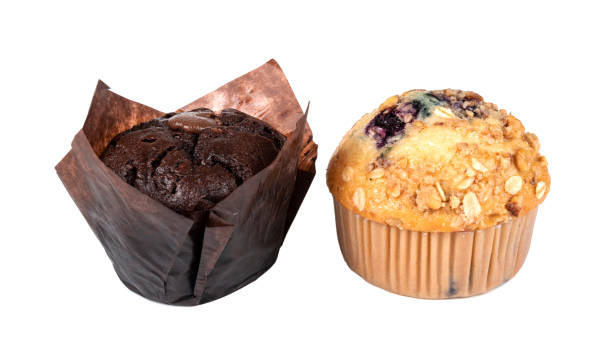 istock Muffins in brown paper isolated on white background 1319932588