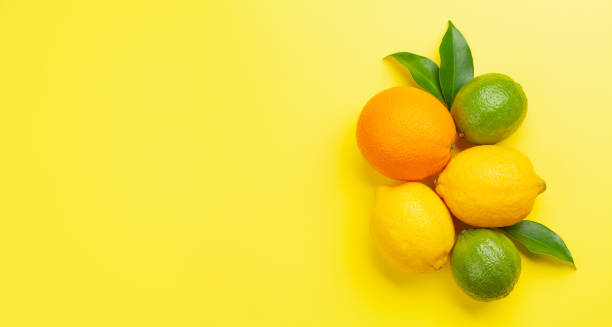 istock Fresh ripe citrus fruits on yellow background 1319933028