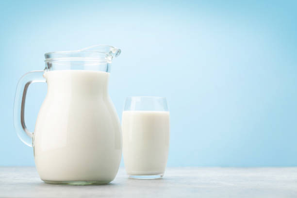 istock Milk jug and glass 1319933139