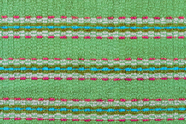 istock old turquoise towel with horizontal stripes ornament - flat background and texture 1319935069