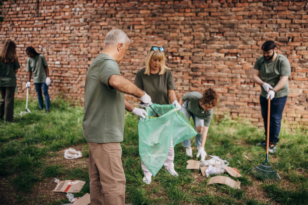 istock Group of volunteers cleaning environment 1319935743