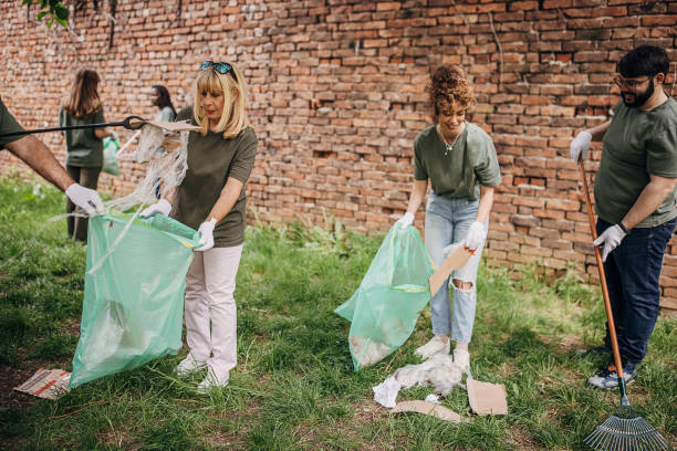 istock Group of volunteers cleaning park 1319935767