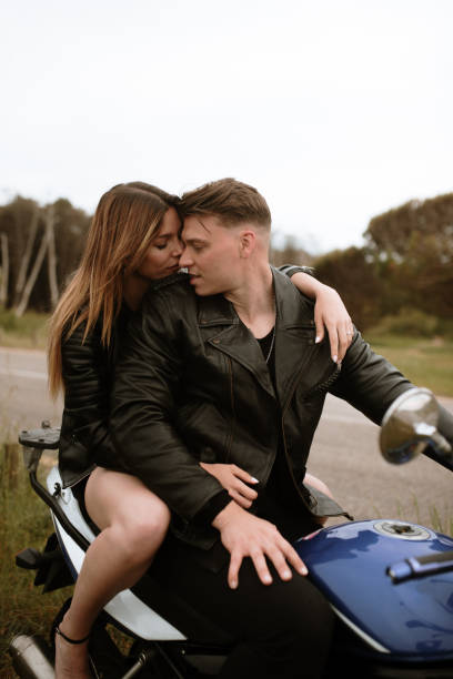 istock Young couple on a motorcycle 1319936800