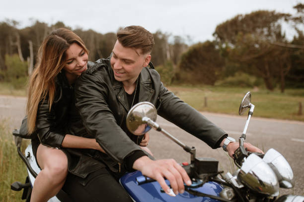 istock Young couple on a motorcycle 1319936813