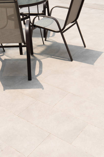 istock Outdoor terrace area with grey floor tile with sitting area. 1319936970