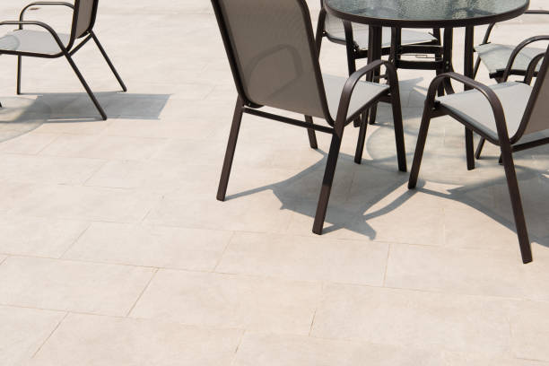 istock Outdoor terrace area with grey floor tile with sitting area. 1319936995