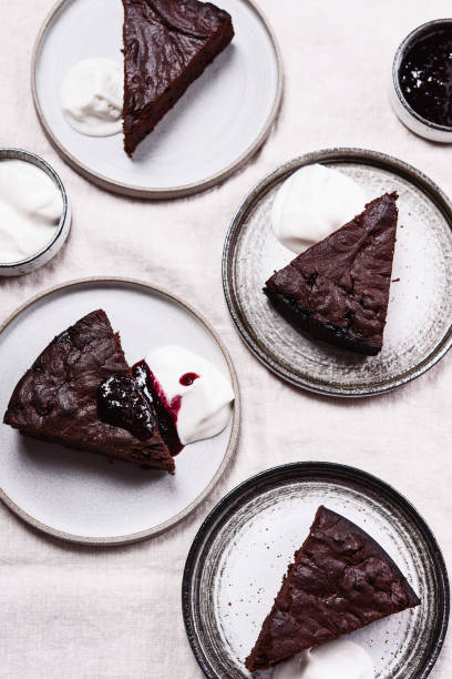 istock Slices of rich moist chocolate cherry cake 1319938241