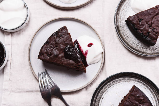 istock Slices of rich moist chocolate cherry cake 1319938270