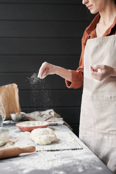 istock Woman making a dough for baking cakes 1319938627