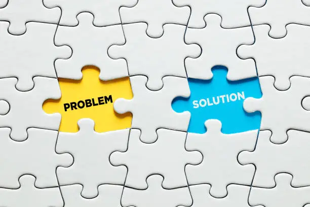 Photo of Missing puzzle pieces with the opposite words problem and solution. Problem solving in business