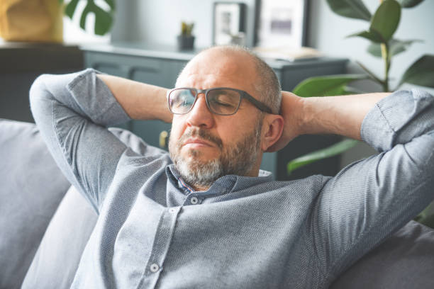 istock mature adult man working from home office ( overworked) 1319939979