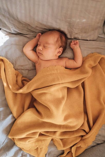 istock Bonding With Newborn: Cute Baby Having a Nap 1319940058