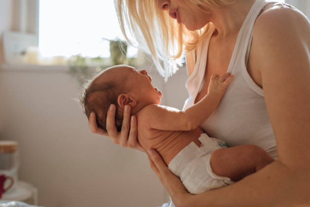 istock Bonding With Newborn: Mother Calms Crying Baby 1319940169