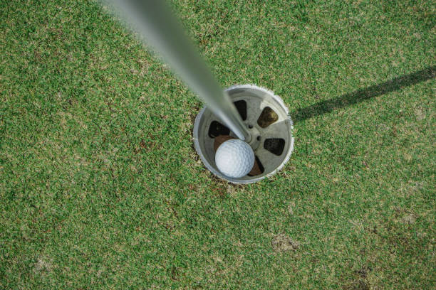 istock Hole in One. Golf ball in the hole. 1319940248