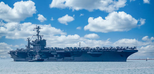 istock Aircraft carrier crossing the ocean 1319941075