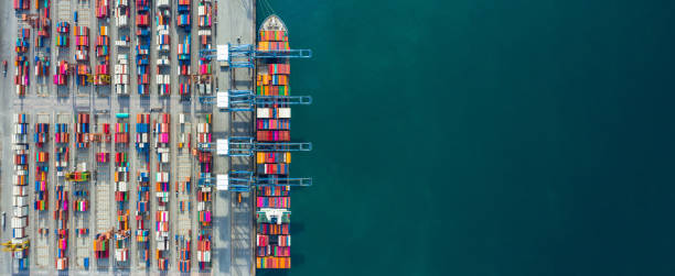 aerial view container ship in port at container terminal port, ship of container ship stand in terminal port on loading, unloading container, commercial cargo ship in sea port. - freight yard imagens e fotografias de stock