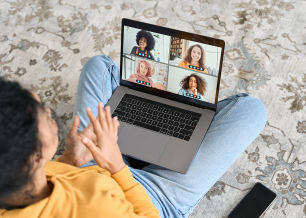 istock African American female student having video call videoconference on laptop. 1319942637