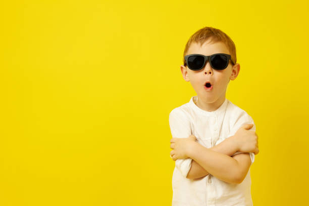 istock A boy in black sunglasses with his arms crossed poses 1319943870