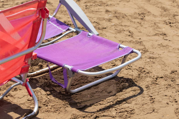 istock Folding sun loungers and hammocks lie on the sand, Spain. 1319944731