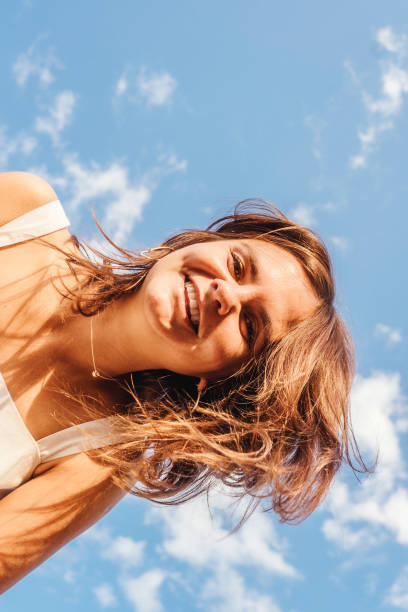 istock Young woman having fun outdoor. Bottom view. 1319947808