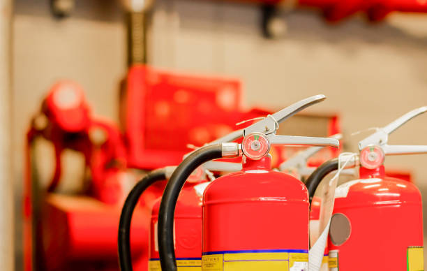 istock The red fire extinguisher is ready for use in case of an indoor fire emergency. 1319947967