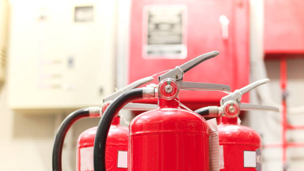 istock The red fire extinguisher is ready for use in case of an indoor fire emergency. 1319948759