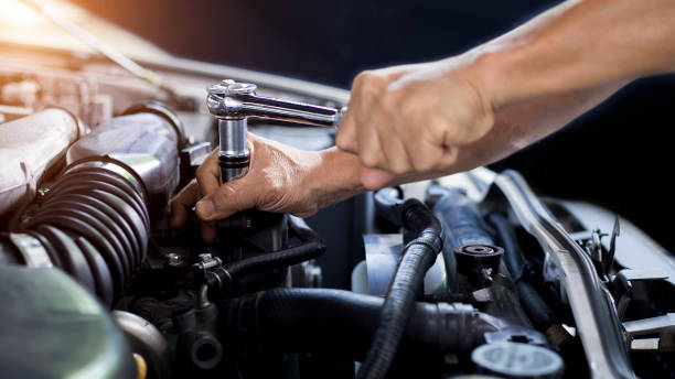 istock Car mechanic working on car engine, car maintenance concept 1319948851