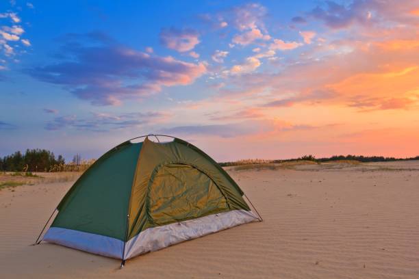 istock small touristic tent in a desert at the evening 1319951260