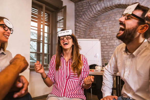 istock Business team having fun at corporate training, funny teambuilding activity, 1319952694