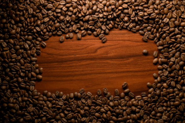 istock composition of brown roasted coffee beans. Can be used as background. 1319953060