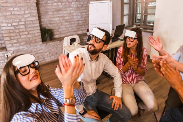 istock Business team having fun at corporate training, funny teambuilding activity, 1319953061