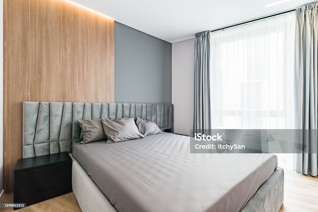 Spacious and bright bedroom Spacious and modern bedroom, with large, king size bed. Large Stock Photo