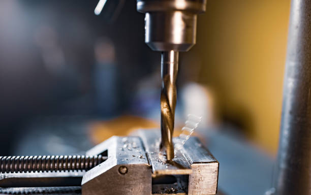 istock Drilling process with shavings close-up at the workplace in workshop 1319954662