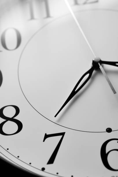 istock Close up of a clock isolated 1319956439