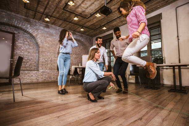 istock Business people having fun together at office party. 1319956628